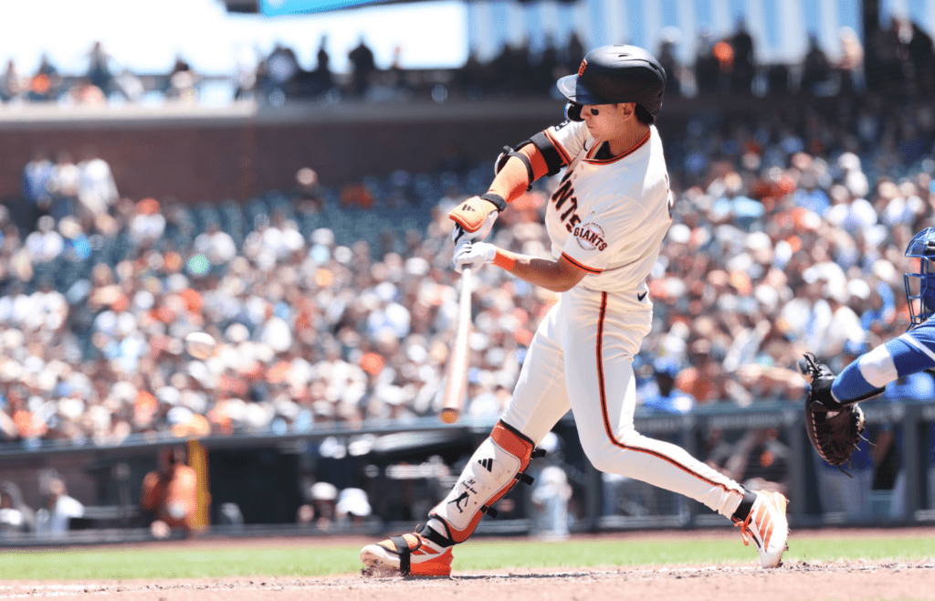 May 21, 2025; San Francisco, California, USA; San Francisco Giants center fielder Jung Hoo Lee (51) hits a double against the Kansas City Royals during the third inning at Oracle Park. Mandatory Credit: Kelley L Cox-Imagn Images