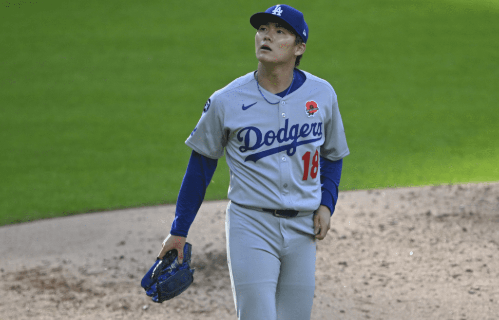 May 26, 2025; Cleveland, Ohio, USA; Los Angeles Dodgers starting pitcher Yoshinobu Yamamoto (18) walks of the field after the third inning against the Cleveland Guardians at Progressive Field. Mandatory Credit: David Richard-Imagn Images