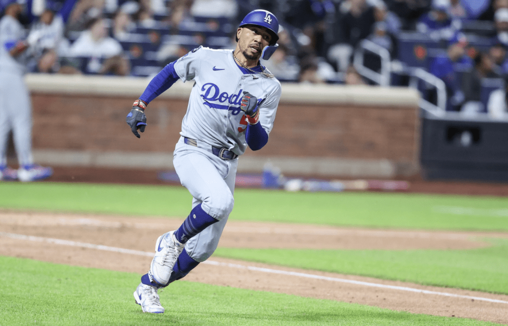 May 24, 2025; New York City, New York, USA; Los Angeles Dodgers shortstop Mookie Betts (50) hits a single in the sixth inning against the New York Mets at Citi Field. Mandatory Credit: Wendell Cruz-Imagn Images