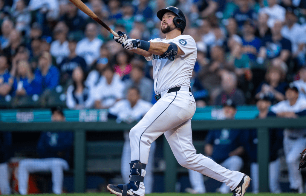 May 27, 2025; Seattle, Washington, USA; Seattle Mariners catcher Cal Raleigh (29) hits a solo home run during the first inning against the Washington Nationals at T-Mobile Park. Mandatory Credit: Stephen Brashear-Imagn Images