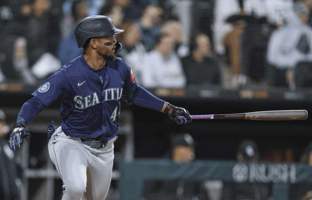 May 19, 2025; Chicago, Illinois, USA; Seattle Mariners center fielder Julio Rodríguez (44) watches his grand slam against the Chicago White Sox during the eight inning at Rate Field. Mandatory Credit: Kamil Krzaczynski-Imagn Images