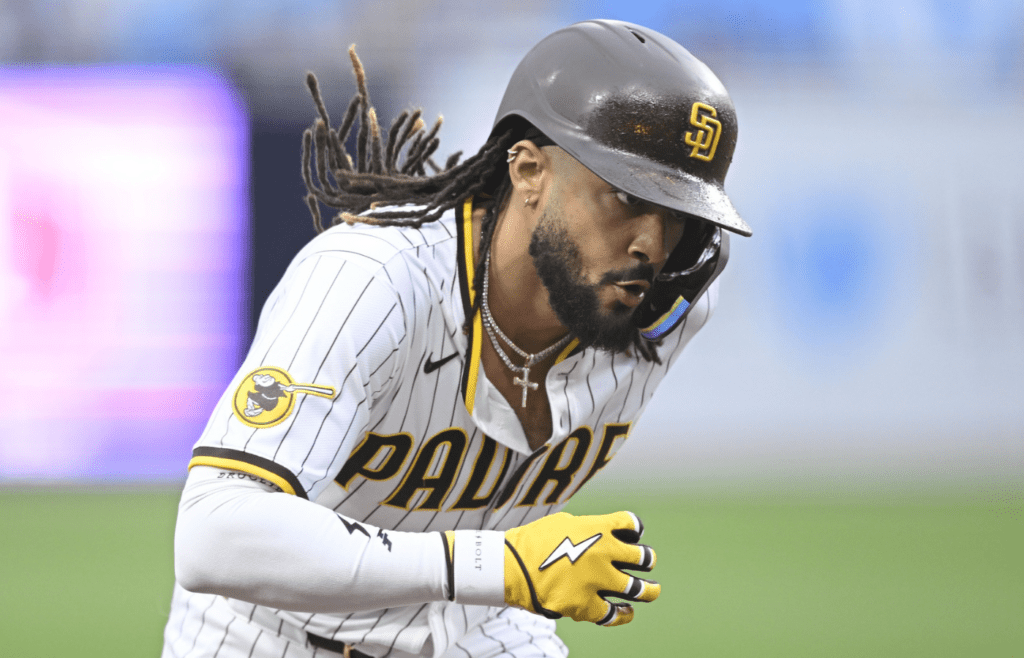May 27, 2025; San Diego, California, USA; San Diego Padres outfielder Fernando Tatis Jr. (23) rounds the bases after hitting a solo home run during the first inning against the Miami Marlins at Petco Park. Mandatory Credit: Denis Poroy-Imagn Images
