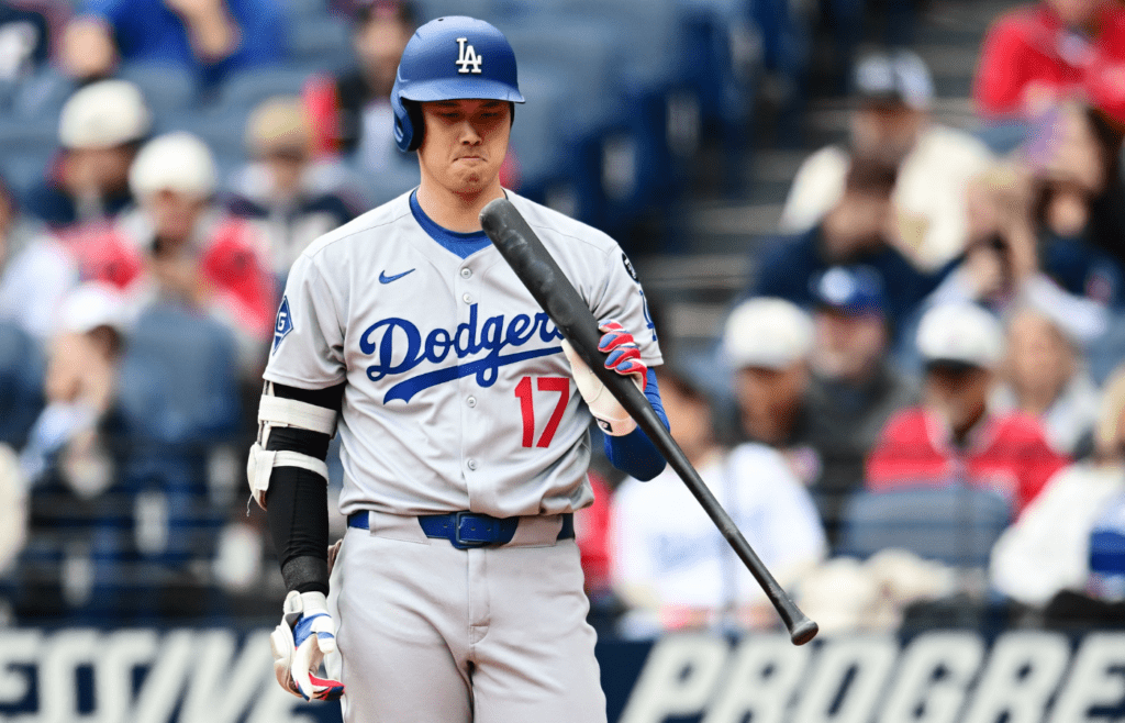 May 28, 2025; Cleveland, Ohio, USA; Los Angeles Dodgers designated hitter Shohei Ohtani (17) inspects his bat during the third inning against the Cleveland Guardians at Progressive Field. Mandatory Credit: Ken Blaze-Imagn Images