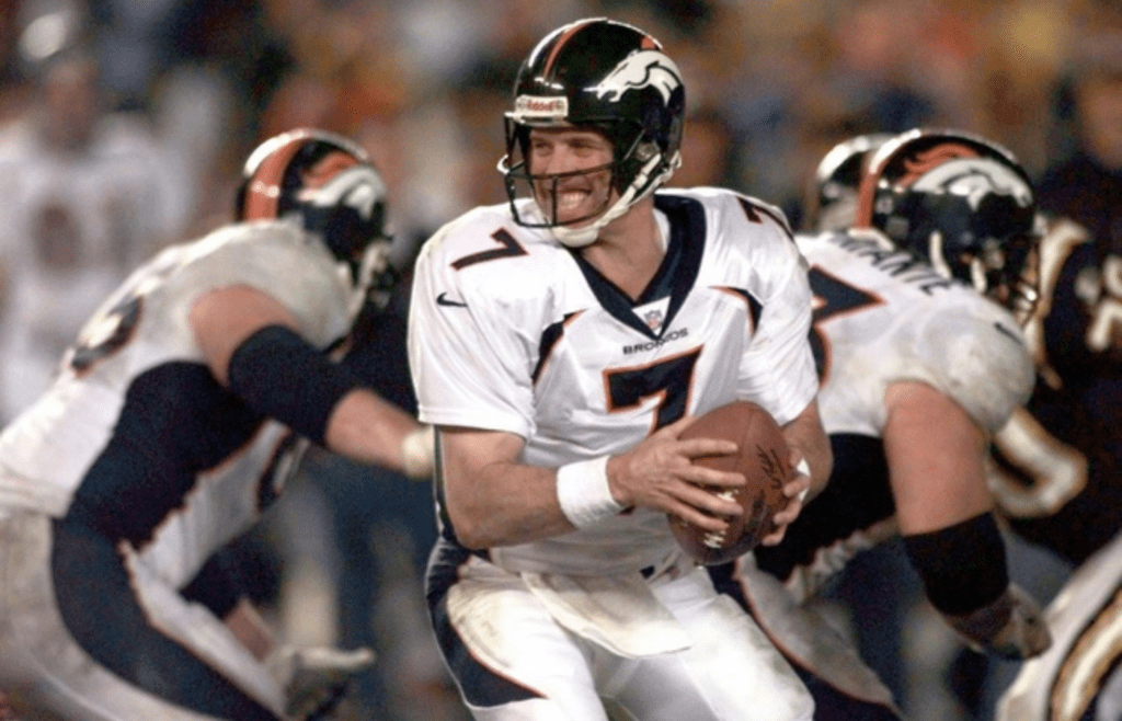 Denver quarterback John Elway is all smiles as he drops back into the pocket during the Broncos' win over San Diego on Nov. 30, 1997