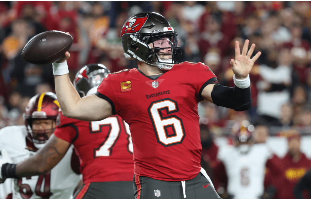 Jan 12, 2025; Tampa, Florida, USA; Tampa Bay Buccaneers quarterback Baker Mayfield (6) throws during the second quarter of a NFC wild card playoff against the Washington Commanders at Raymond James Stadium. Mandatory Credit: Kim Klement Neitzel-Imagn Images