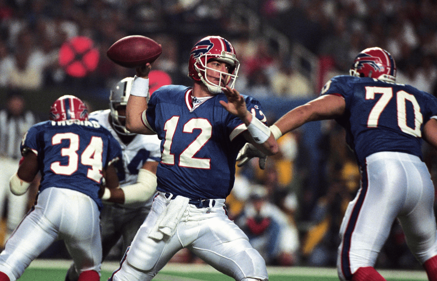 Buffalo Bills quarterback Jim Kelly (12) looks to throw against the Dallas Cowboys during Super Bowl XXVIII at the Georgia Dome. Dallas defeated Buffalo 30-13.