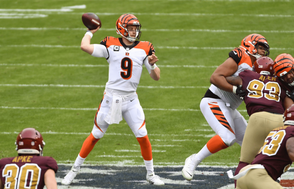 Nov 22, 2020; Landover, Maryland, USA; Cincinnati Bengals quarterback Joe Burrow (9) attempts a pass against the Washington Football Team during the second quarter at FedExField. Mandatory Credit: Brad Mills-Imagn Images