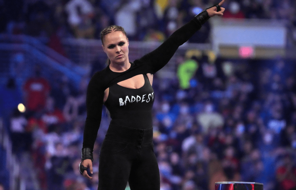 Jan 29, 2022; St. Louis, MO, USA; Ronda Rousey celebrates after winning the women s Royal Rumble match during the Royal Rumble at The Dome at America's Center. Mandatory Credit: Joe Camporeale-Imagn Images