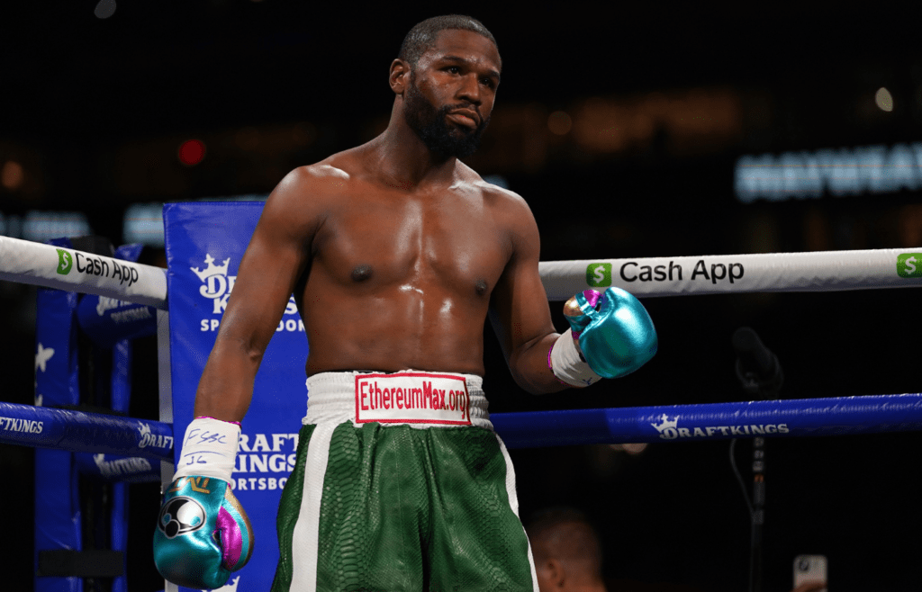 Jun 6, 2021; Miami, Florida, USA; Floyd Mayweather Jr. (Green Trunks) stands in the ring prior to his fight against Logan Paul (not pictured) at Hard Rock Stadium. Mandatory Credit: Jasen Vinlove-Imagn Images