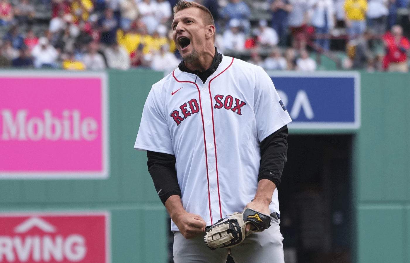Apr 15, 2024; Boston, Massachusetts, USA; Former NFL player Rob Gronkowski reacts to throwing out a ceremonial first pitch prior to the game between the Cleveland Guardians and Boston Red Sox at Fenway Park. Mandatory Credit: Gregory Fisher-Imagn Images
