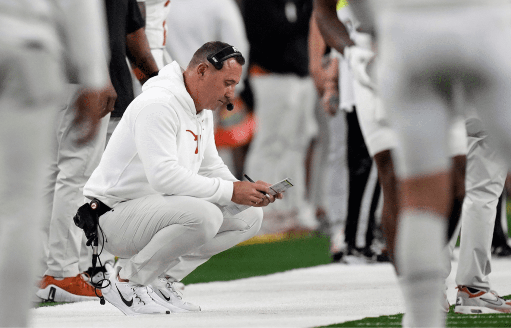 Texas Longhorns head coach Steve Sarkisian looks at his play sheet against Ohio State Buckeyes in the second quarter of the Cotton Bowl Classic during the College Football Playoff semifinal game at AT&T Stadium in Arlington, Texas on January, 10, 2025