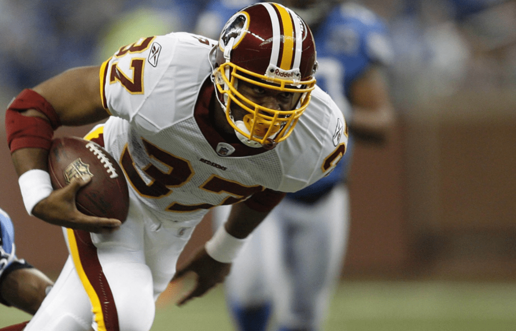 October 26, 2008; Detroit, MI, USA; Washington Redskins running back Shaun Alexander (37) run for a short gain as Detroit Lions defensive back Leigh Bodden (28) makes the stop. The Redskins defeated the Lions 5-17. Mandatory Credit: Leon Halip-Imagn Images