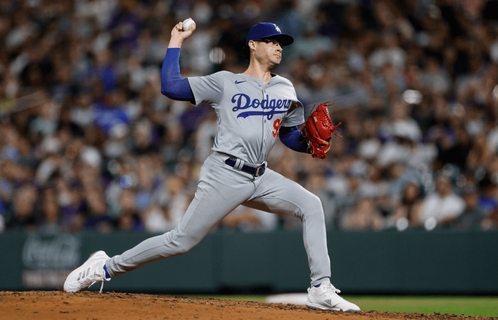 Sep 27, 2024; Denver, Colorado, USA; Los Angeles Dodgers relief pitcher Joe Kelly (99) pitches in the sixth inning against the Colorado Rockies at Coors Field. Mandatory Credit: Isaiah J. Downing-Imagn Images