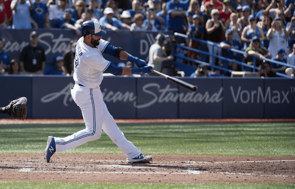 Sep 24, 2017; Toronto, Ontario, CAN; Toronto Blue Jays right fielder Jose Bautista (19) hits a RBI single in the fourth inning during a game against the New York Yankees at Rogers Centre. Mandatory Credit: Nick Turchiaro-Imagn Images