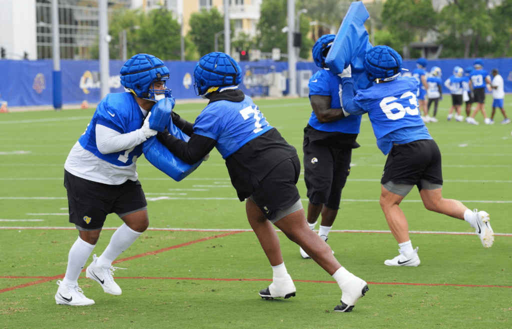 May 28, 2025; Woodland Hills, CA, USA; Los Angeles Rams offensive linemen (from left) Steve Avila (73), Warren McClendon Jr. (71), Kevin Dotson (69) and Dylan McMahon (63) participate in drills during organized team activities at Rams Practice Facility. Mandatory Credit: Kirby Lee-Imagn Images