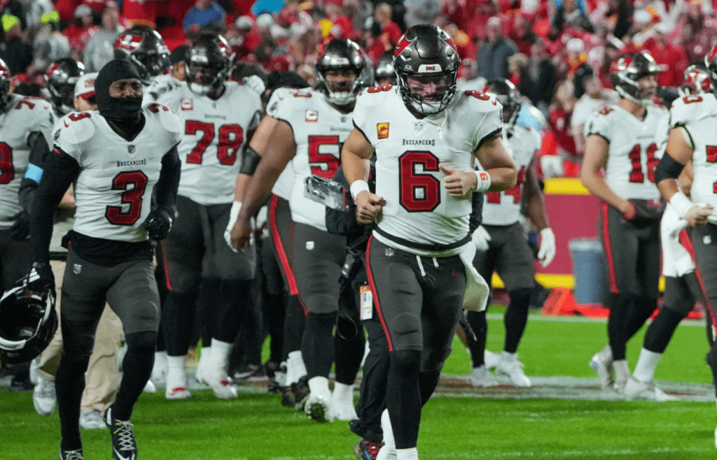 Nov 4, 2024; Kansas City, Missouri, USA; Tampa Bay Buccaneers quarterback Baker Mayfield (6), running back Bucky Irving (7) and team mates take the field against the Kansas City Chiefs prior to a game at GEHA Field at Arrowhead Stadium. Mandatory Credit: Denny Medley-Imagn Images