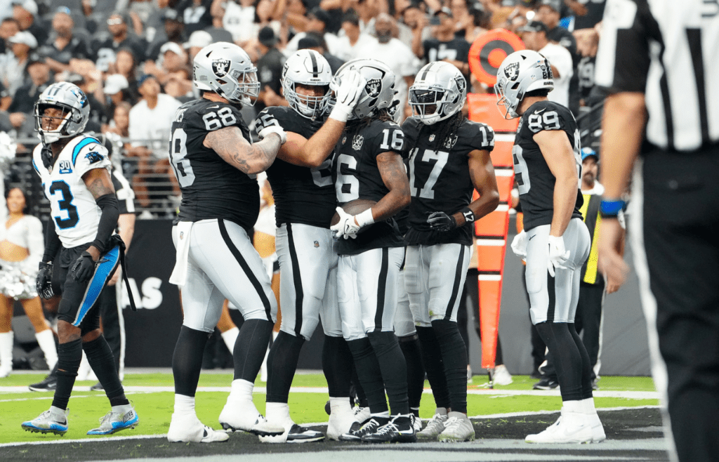 Sep 22, 2024; Paradise, Nevada, USA; Las Vegas Raiders wide receiver Jakobi Meyers (16) celebrates with team mates after scoring a touchdown against the Carolina Panthers during the fourth quarter at Allegiant Stadium. Mandatory Credit: Stephen R. Sylvanie-Imagn Images