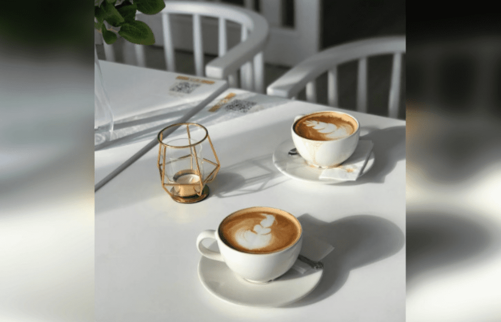 Cups of Coffee with Latte Art on White Table