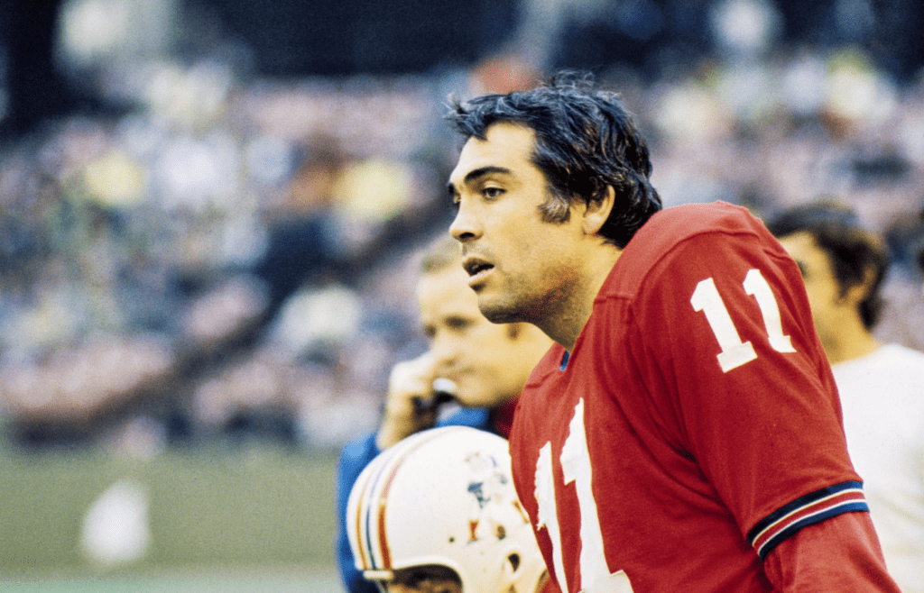 Nov 8, 1970; St. Louis, MO, USA; FILE PHOTO; Boston Patriots quarterback Joe Kapp (11) looks on from the sidelines at Busch Stadium during the 1970 season game against the St. Louis Cardinals. Mandatory Credit Herb Weitman-Imagn Images