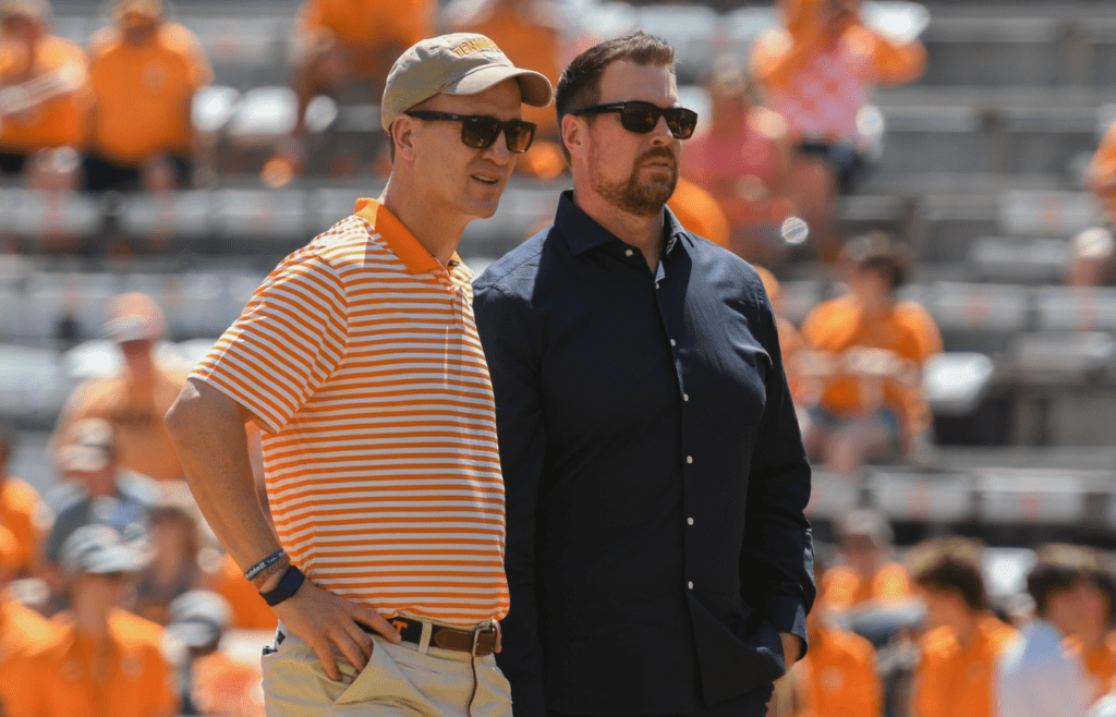 Aug 31, 2019; Knoxville, TN, USA; NFL former quarterbacks Peyton Manning (left) and Ryan Leaf watch the Tennessee Volunteers warm up before a game against the Georgia State Panthers at Neyland Stadium. Mandatory Credit: Randy Sartin-Imagn Images