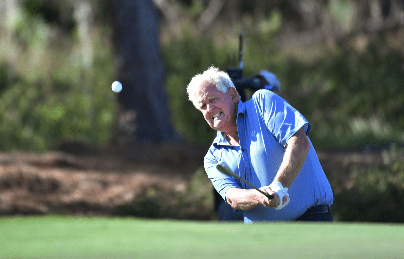 Team Europe member Colin Montgomerie chips onto the par three, fifth hole on the first day of competition of the inaugural World Champions Cup three-day, three-team competition Wednesday, Dec. 7, 2023 at The Concession Golf Club in Bradenton, Florida