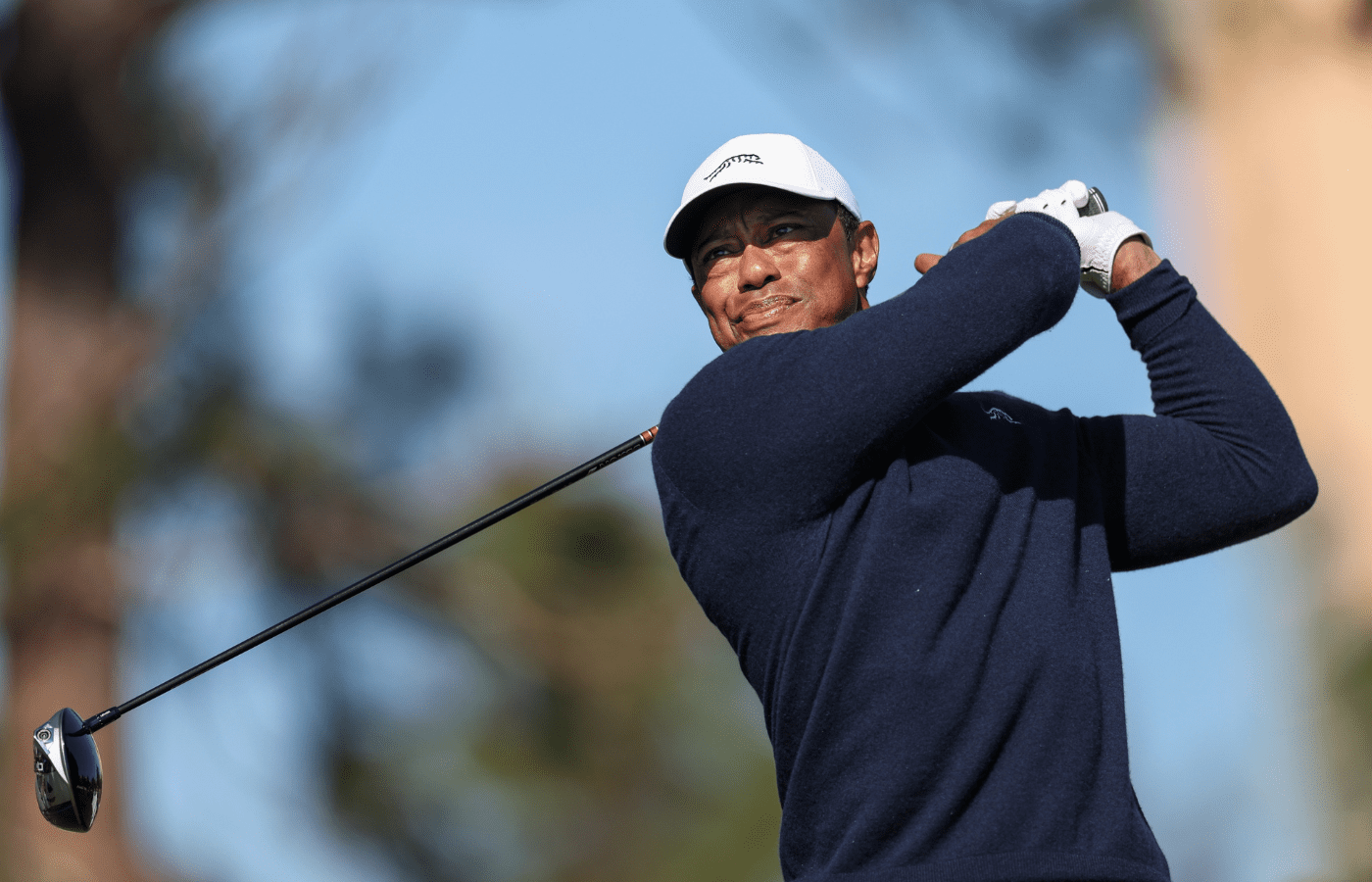 Tiger Woods tees off on the fifth hole during the PNC Championship at The Ritz-Carlton Golf Club.