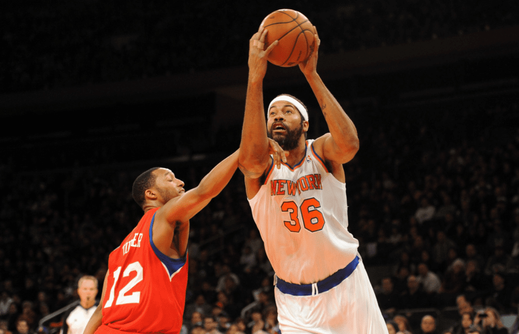Nov 4, 2012; New York, NY, USA; New York Knicks forward Rasheed Wallace (36) draws a foul against Philadelphia 76ers forward Evan Turner (12) during the second half at Madison Square Garden. The Knicks won the game 100-84. Mandatory Credit: Joe Camporeale-Imagn Images