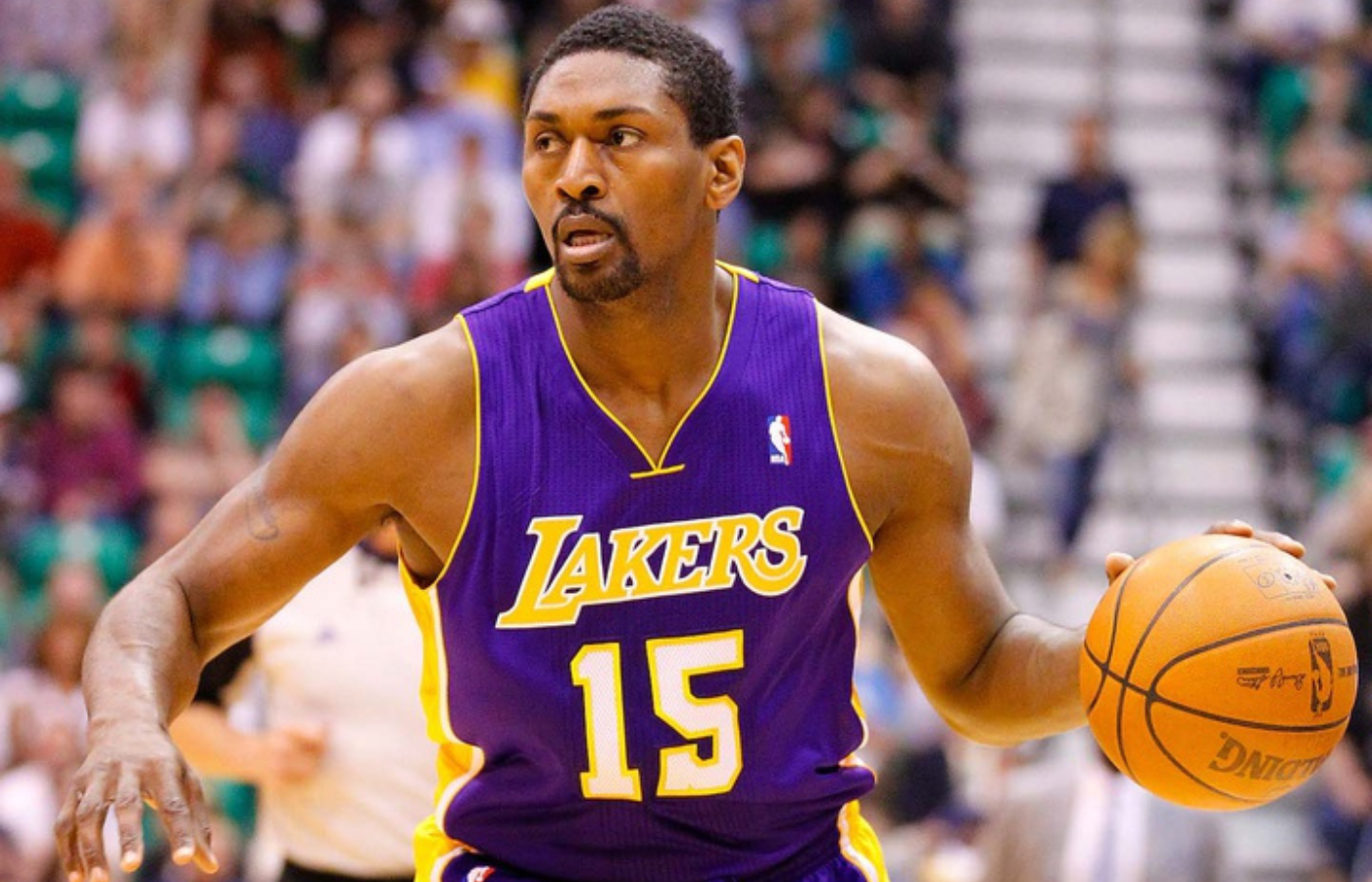April 1, 2011; Salt Lake City, UT, USA; Los Angeles Lakers small forward Ron Artest (15) dribbles during the first half of a game against the Utah Jazz at EnergySolutions Arena. The Lakers won 96-85. Mandatory Credit: Russ Isabella-Imagn Images