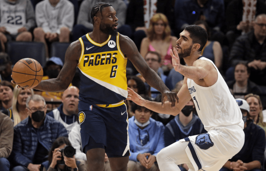 Mar 24, 2022; Memphis, Tennessee, USA; Indiana Pacers forward Lance Stephenson (6) passes the ball as Memphis Grizzlies forward Santi Aldama (7) defends during the second half at FedExForum. Mandatory Credit: Petre Thomas-Imagn Images
