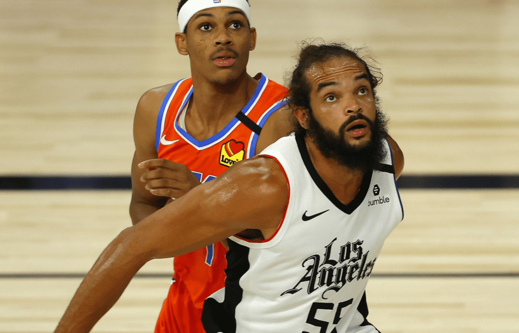 Aug 14, 2020; Lake Buena Vista, Florida, USA; Darius Bazley #7 of the Oklahoma City Thunder and Joakim Noah #55 of the LA Clippers battle for a pass during the second quarter at The Field House at ESPN Wide World of Sports Complex. Mandatory Credit: Mike Ehrmann/Pool Photo-Imagn Images