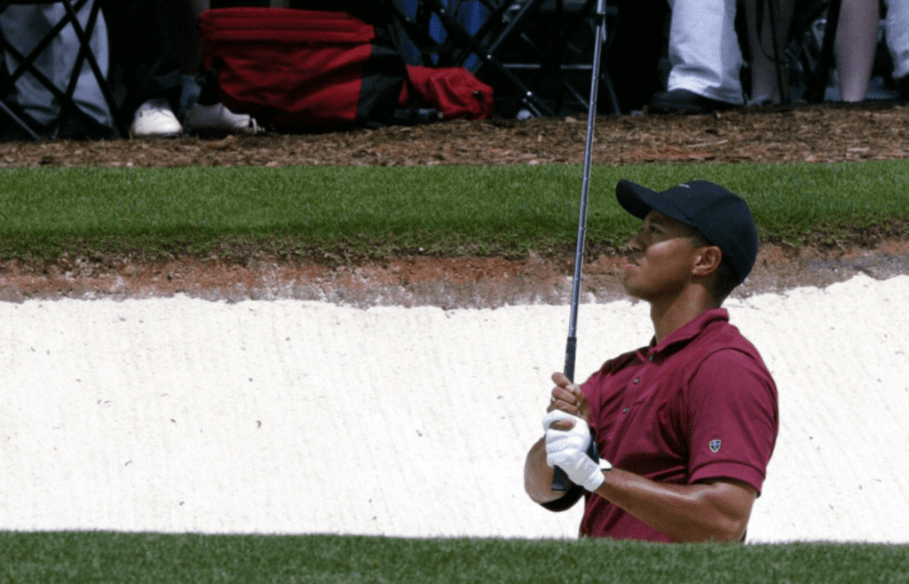 April 14, 2002; Augusta, GA, USA; Tiger Woods watches his shot out of the sand on the first hole during the final round of the 2002 Masters. Mandatory Credit: Tim Dillon/USA TODAY ***EDITORIAL USE ONLY