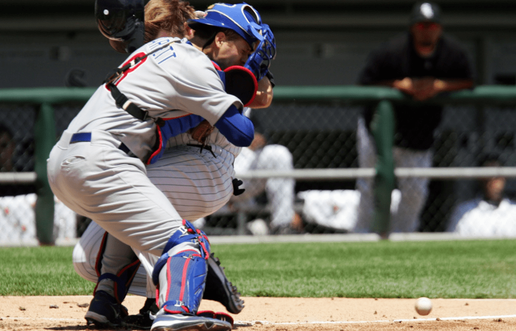 May 20, 2006; Chicago, IL, USA; Chicago White Sox catcher A.J. Pierzynski (12) collides with Chicago cubs catcher Michael Barrett (5) to score a run during the second inning at US Cellular Field in Chicago, IL. Mandatory Credit: Jerry Lai-Imagn Images © Copyright 2006 Jerry Lai