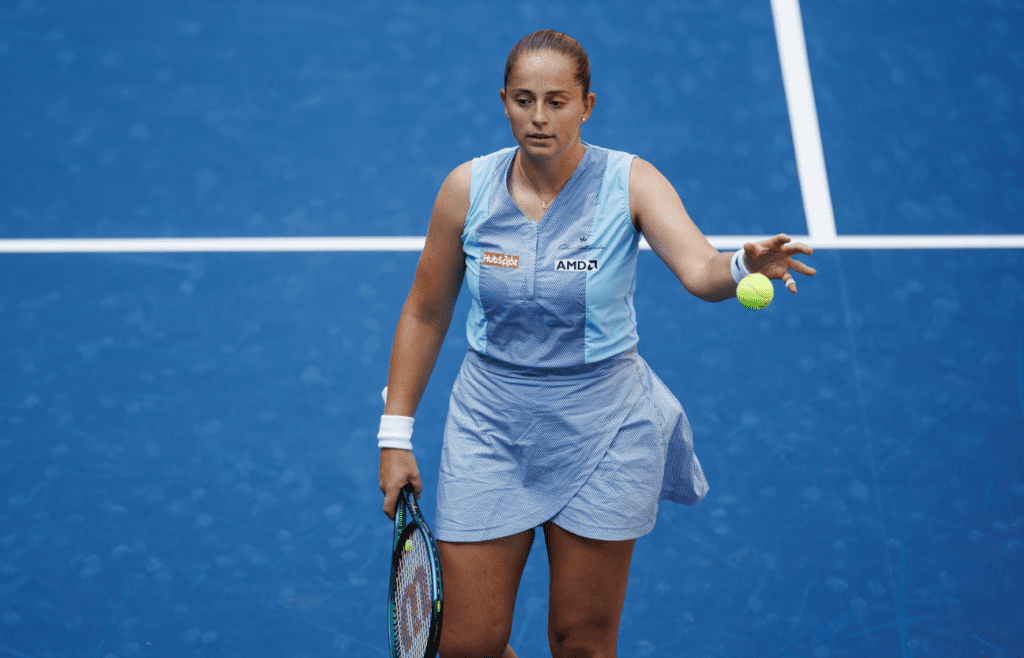 Aug 27, 2024; Flushing, NY, USA; Jelena Ostapenko of Latvia in action against Naomi Osaka of Japan in the first round of the women’s singles in the US Open at the USTA Billie Jean King Tennis Center. Mandatory Credit: Mike Frey-Imagn Images
