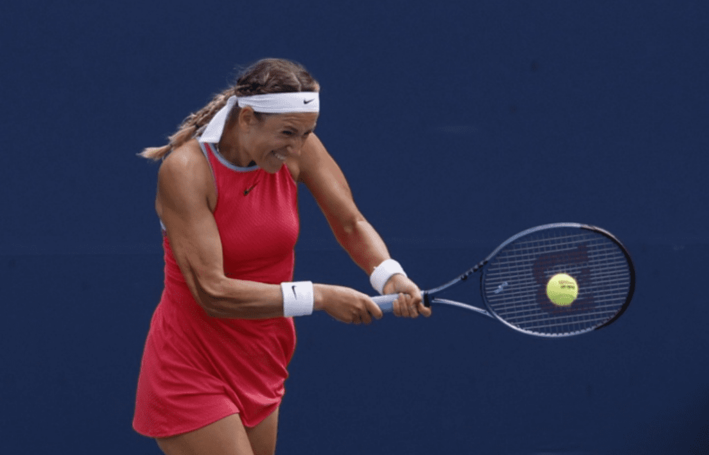 Aug 30, 2024; Flushing, NY, USA; Victoria Azarenka hits a backhand against Yafan Wang (CHN) (not pictured) in a women's singles match on day five of the 2024 U.S. Open tennis tournament at Billie Jean King USTA National Tennis Center. Mandatory Credit: Geoff Burke-Imagn Images