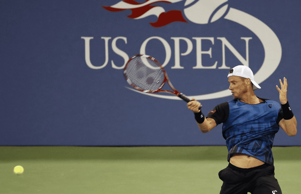 Sep 3, 2015; New York, NY, USA; Lleyton Hewitt of Australia his a forehand against Bernard Tomic of Australia (not pictured) on day four of the 2015 U.S. Open tennis tournament at USTA Billie Jean King National Tennis Center. Tomic won 6-3, 6-2, 3-6, 5-7, 7-5. Mandatory Credit: Geoff Burke-Imagn Images