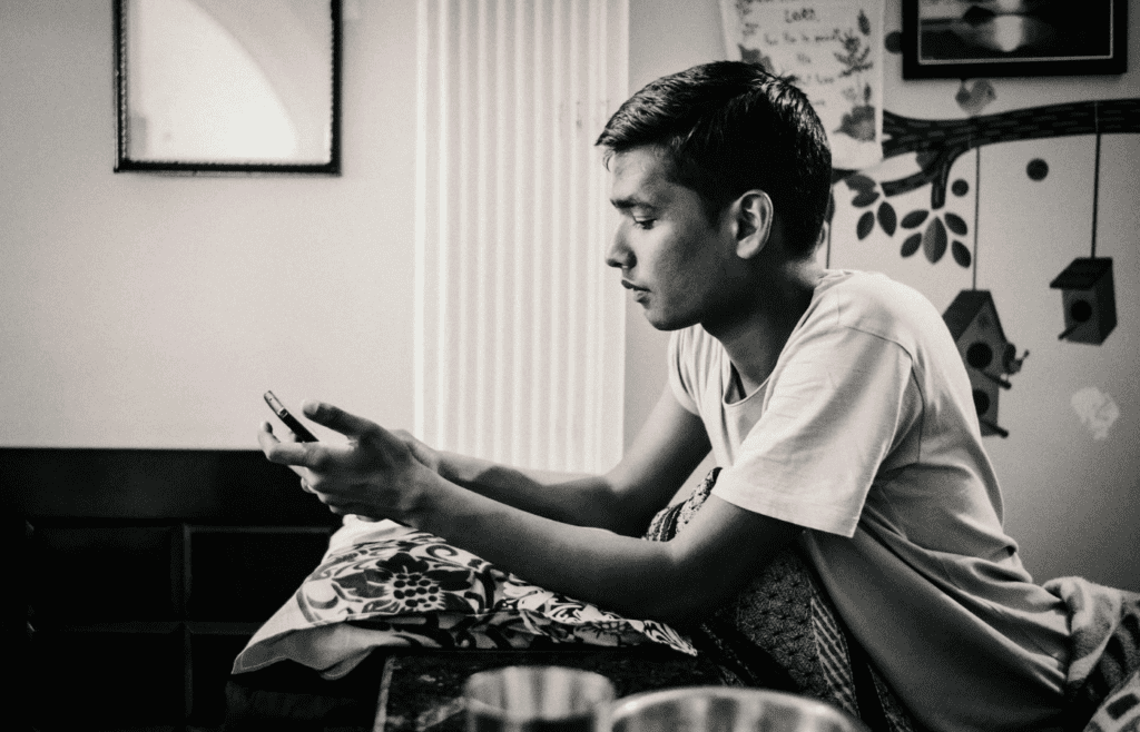 A person looking calm while scrolling on a phone