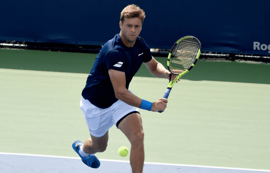 Aug 4, 2018; Toronto, Ontario, Canada; Ryan Harrison of the USA hits a shot against Ernests Gulbis of Latvia (not shown) in the Rogers Cup tennis tournament at Aviva Centre. Mandatory Credit: Dan Hamilton-Imagn Images