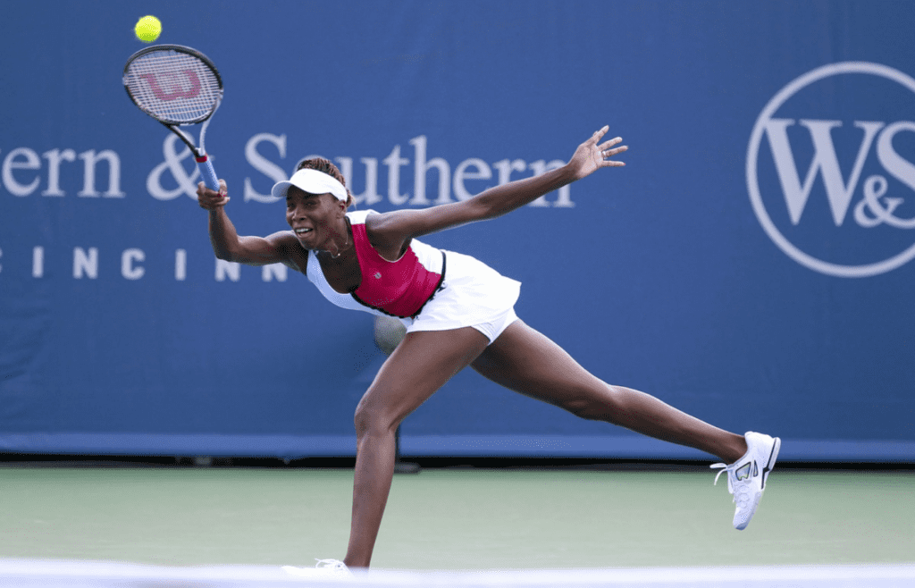 Venus Williams lunges for a shot during her 6-2, 6-7 (2), 6-4 quarterfinal victory over Sam Stosure Friday afternoon. Venus is in the semifinals here for the first time. The Enquirer/Cara Owsley Venus Williams returns a serve from Samantha Stosur on the grandstand during the Western and Southern Open at the Lindner Family Tennis Center. Photo shot on Friday August 17, 2012.Western and Southern Open at the Lindner Family Tennis Center. Photo shot on Friday August 17, 2012.