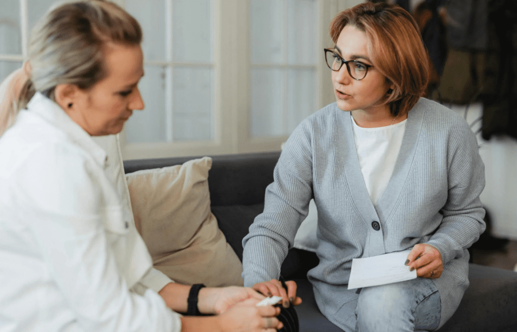 A person talking to a therapist or trusted friend