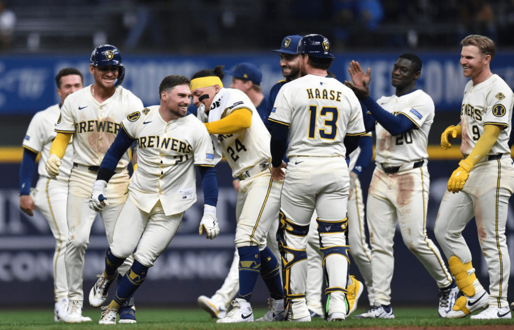 May 28, 2025; Milwaukee, Wisconsin, USA; Milwaukee Brewers third baseman Caleb Durbin (21) celebrates with teammates after the victory over the Boston Red Sox at American Family Field. Mandatory Credit: Patrick Gorski-Imagn Images