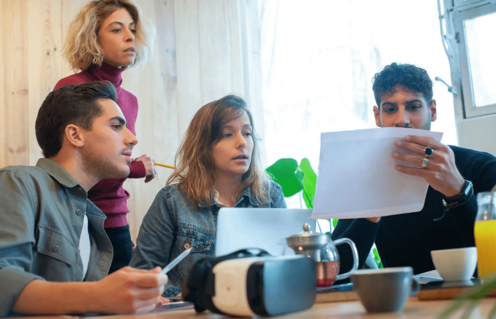 A person speaking calmly in a group setting