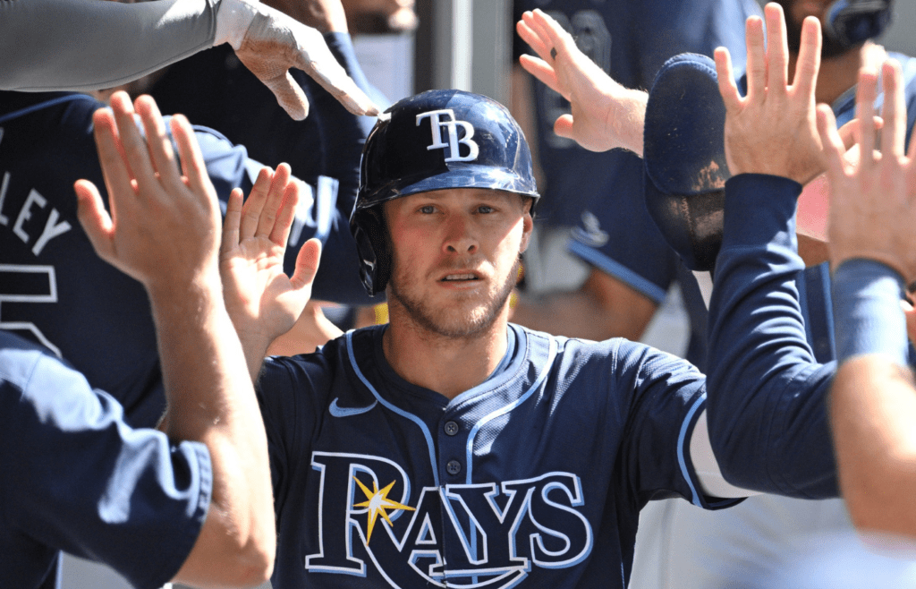 Jul 25, 2024; Toronto, Ontario, CAN; Tampa Bay Rays shortstop Taylor Walls (6) celebrates in the dugout with team mates after scoring a run against the Toronto Blue Jays in the sixth inning at Rogers Centre. Mandatory Credit: Dan Hamilton-Imagn Images