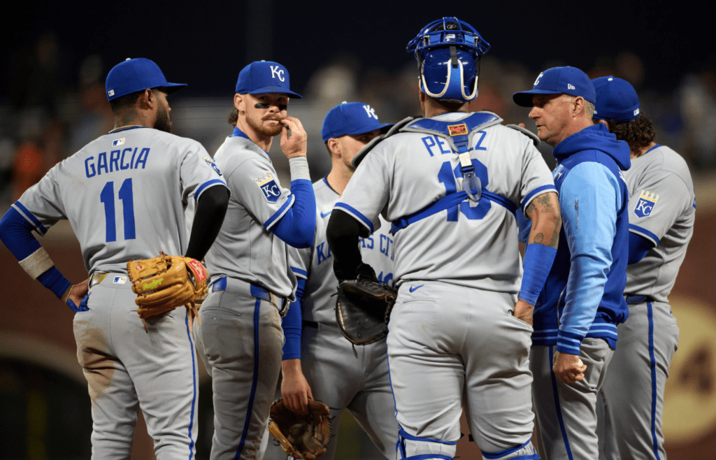 May 20, 2025; San Francisco, California, USA; Kansas City Royals manager Matt Quatraro (33) meets his team on the mound for a pitching change against the San Francisco Giants during the sixth inning at Oracle Park. Mandatory Credit: Robert Edwards-Imagn Images