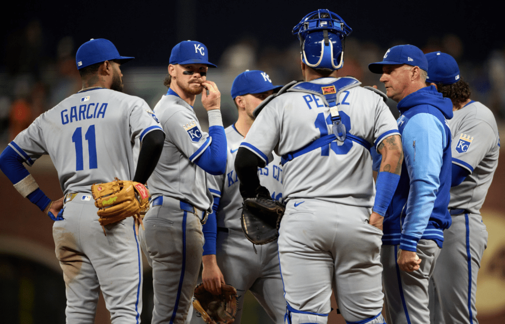 May 20, 2025; San Francisco, California, USA; Kansas City Royals manager Matt Quatraro (33) meets his team on the mound for a pitching change against the San Francisco Giants during the sixth inning at Oracle Park. Mandatory Credit: Robert Edwards-Imagn Images