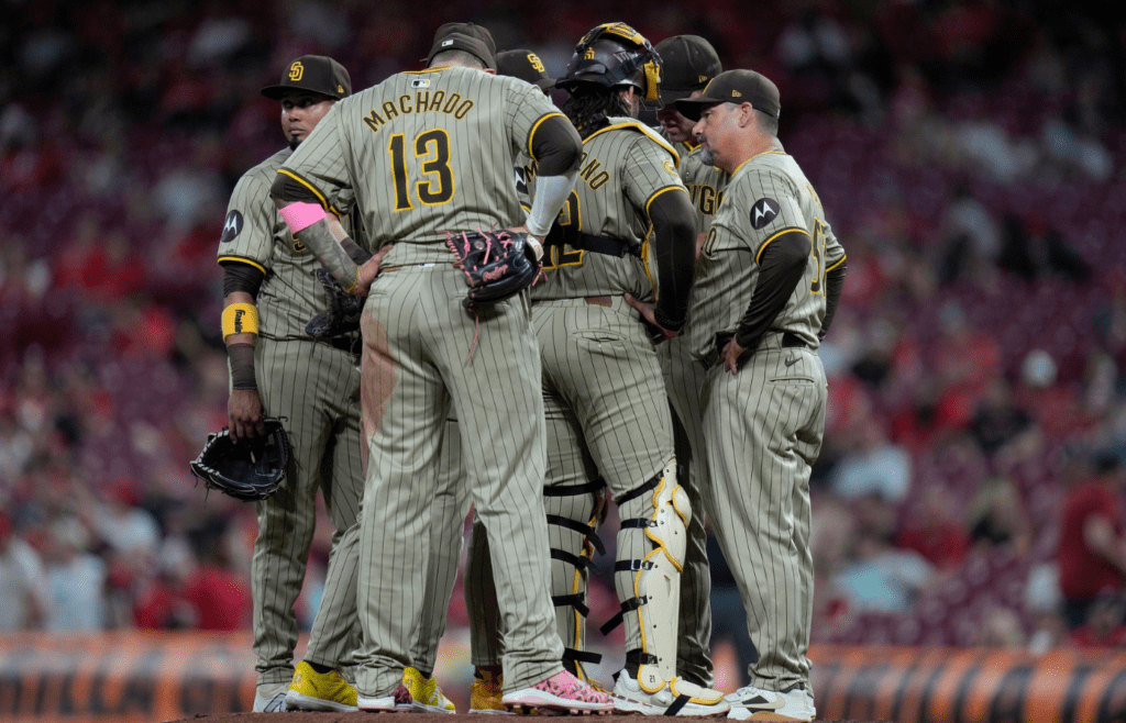 San Diego Padres pitching coach Ruben Niebla (57) right talks with his team as they face the Cincinnati Reds in the 7th inning Wednesday, May 22, 2024, at Great American Ball Park in Cincinnati.