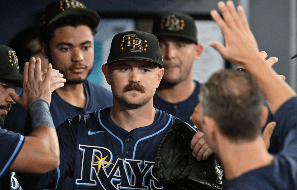May 17, 2024; Toronto, Ontario, CAN; Tampa Bay Rays pitcher Tyler Alexander (14) is greeted by team mates in the dugout after being relieved in the eighth inning against the Toronto Blue Jays at Rogers Centre. Mandatory Credit: Dan Hamilton-Imagn Images