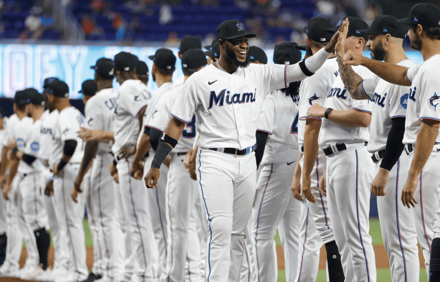 Mar 30, 2023; Miami, Florida, USA; Miami Marlins left fielder Bryan De La Cruz (14) takes on the field during team introductions prior to the game against the New York Mets at loanDepot Park. Mandatory Credit: Sam Navarro-Imagn Images