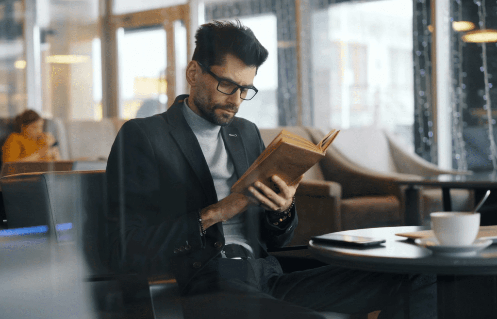 A person reading a self-development book or attending a class