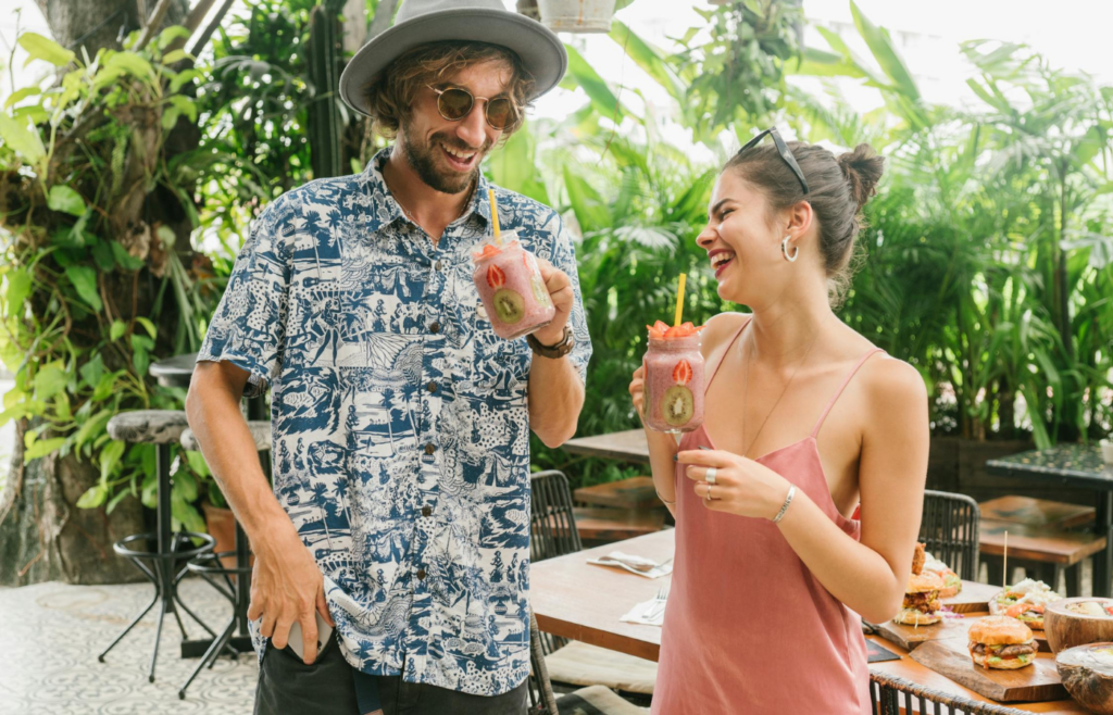 A couple laughing together at a casual restaurant