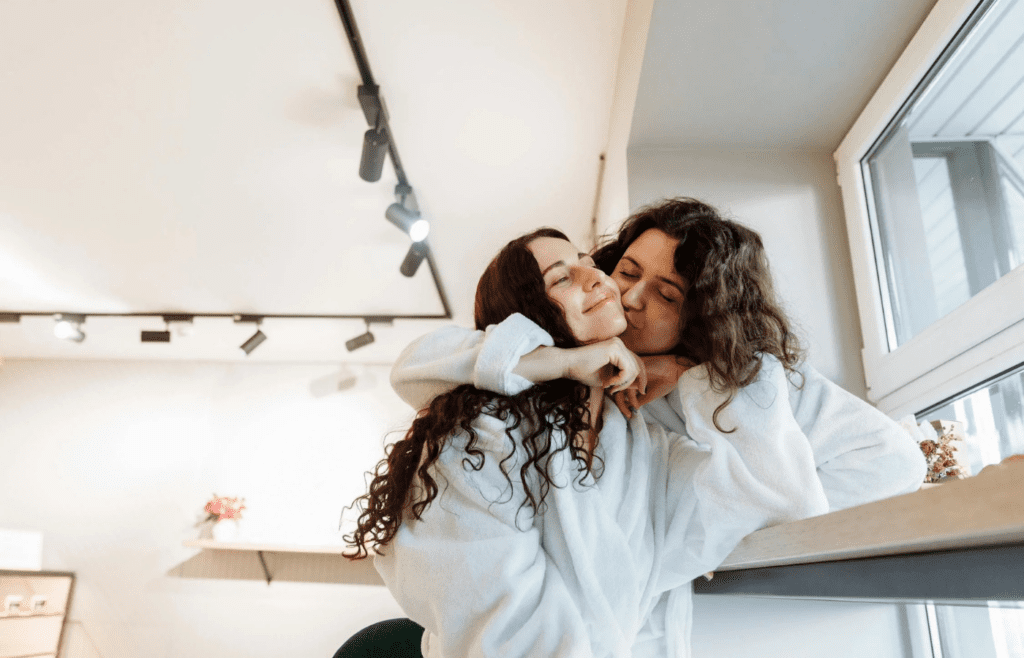 A couple in sweats at home, relaxed and natural